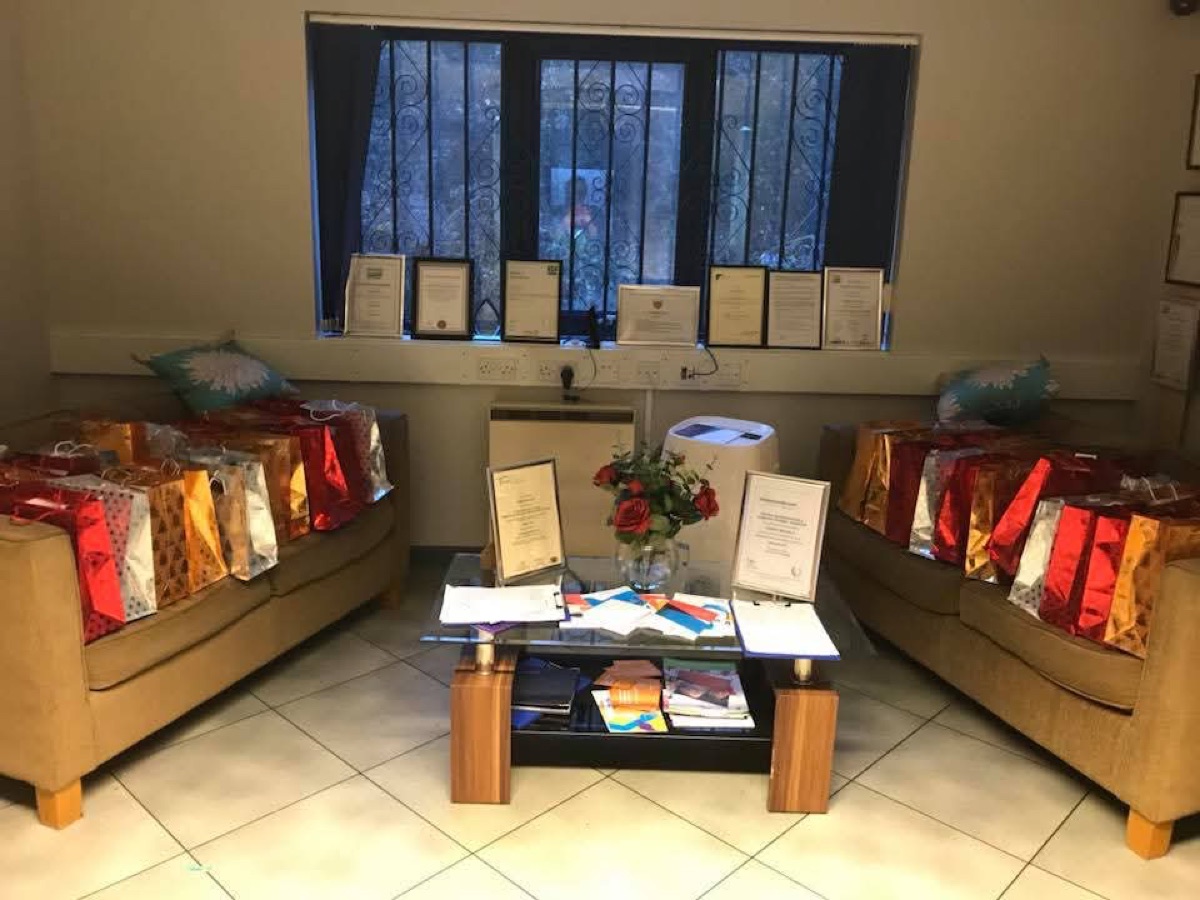 Rows of wrapped gift bags on the sofas in the CSPC office