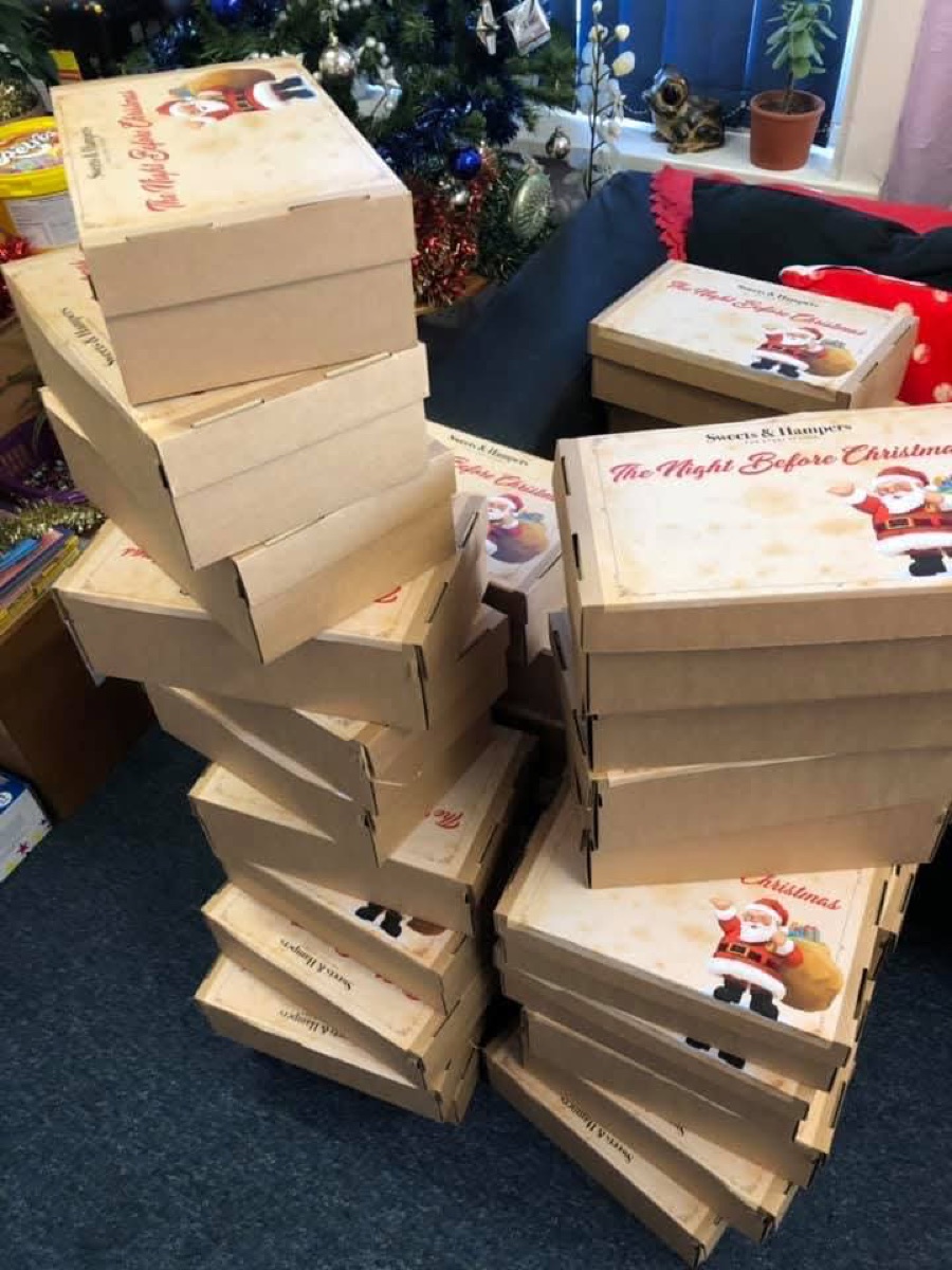 Stacks of Christmas hamper boxes in the CSPC office